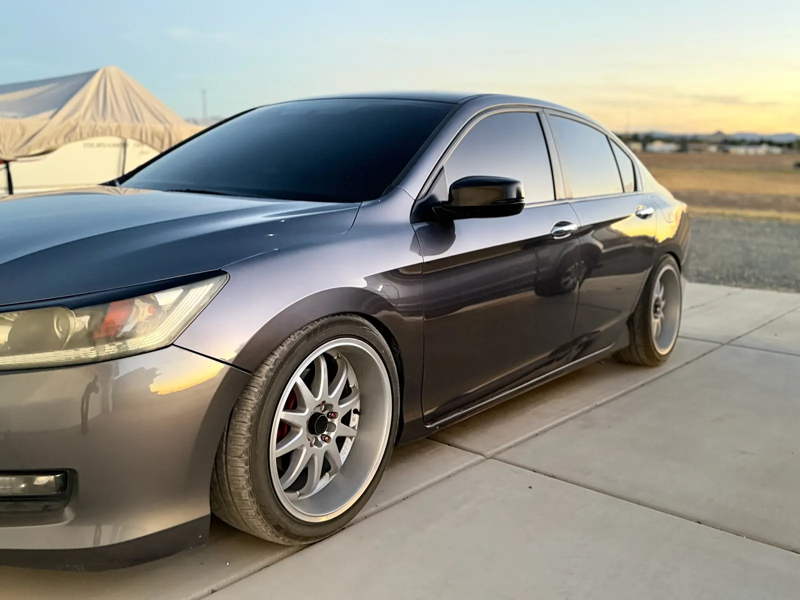 Gray Honda Accord with fresh window tint at sunset